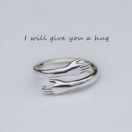The perfect anniversary or promise gift for a partner: the Confession Box hugging hands ring.
